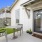 a patio with a table and chairs