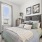 a bedroom with a bed and a lamp