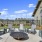 a patio with chairs and a fireplace