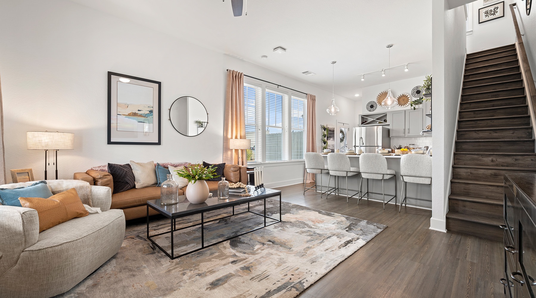 living room with couch coffee table and stairwell